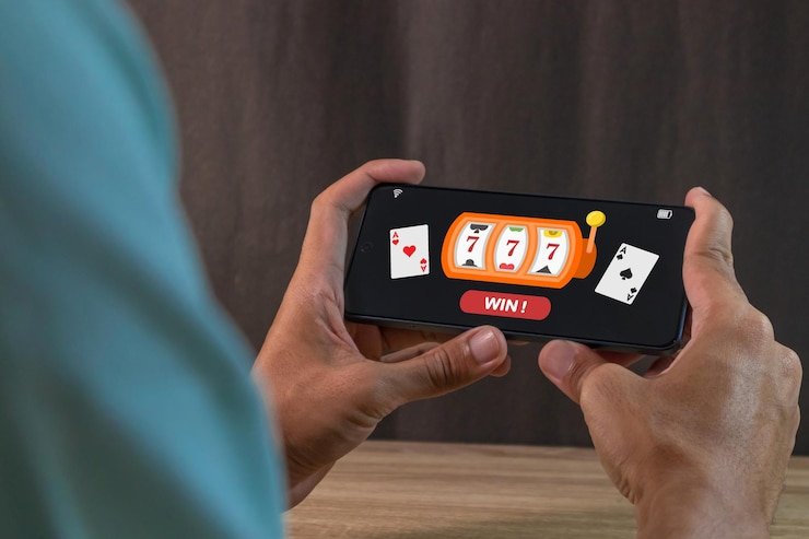 Mobile phone showing 520jl Casino interface with baccarat and slot options